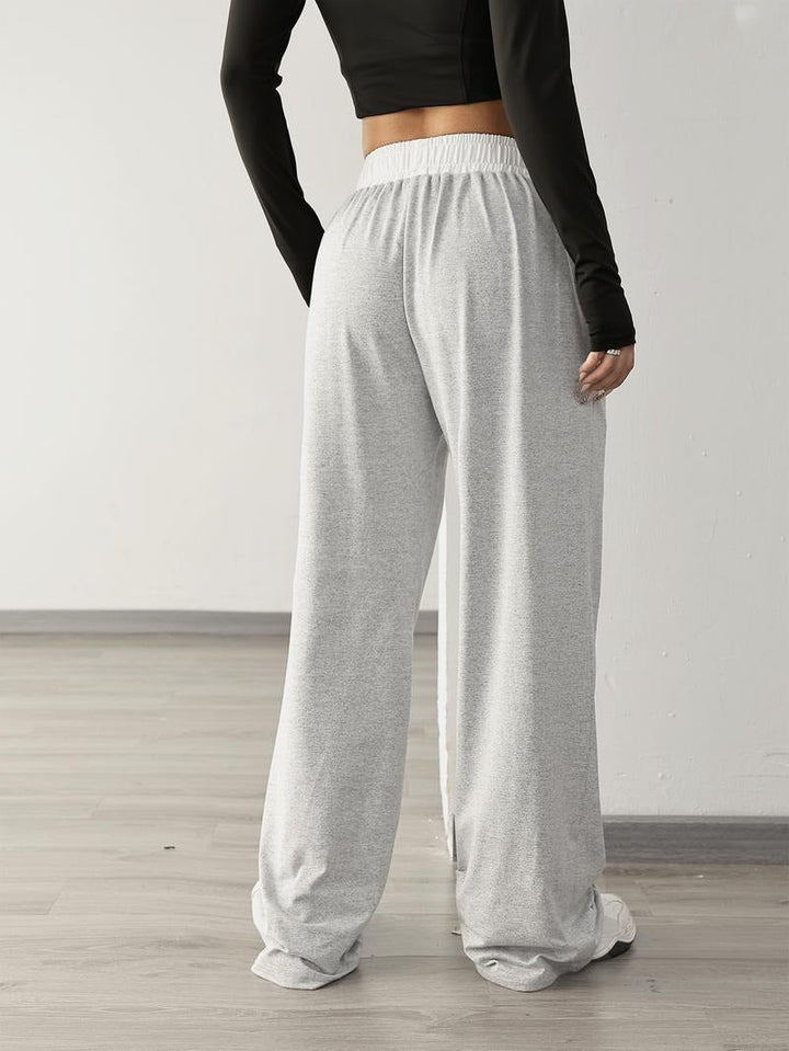 Fashionable women's wide-leg sweatpants with a relaxed fit, combining athleisure style and soft comfort.