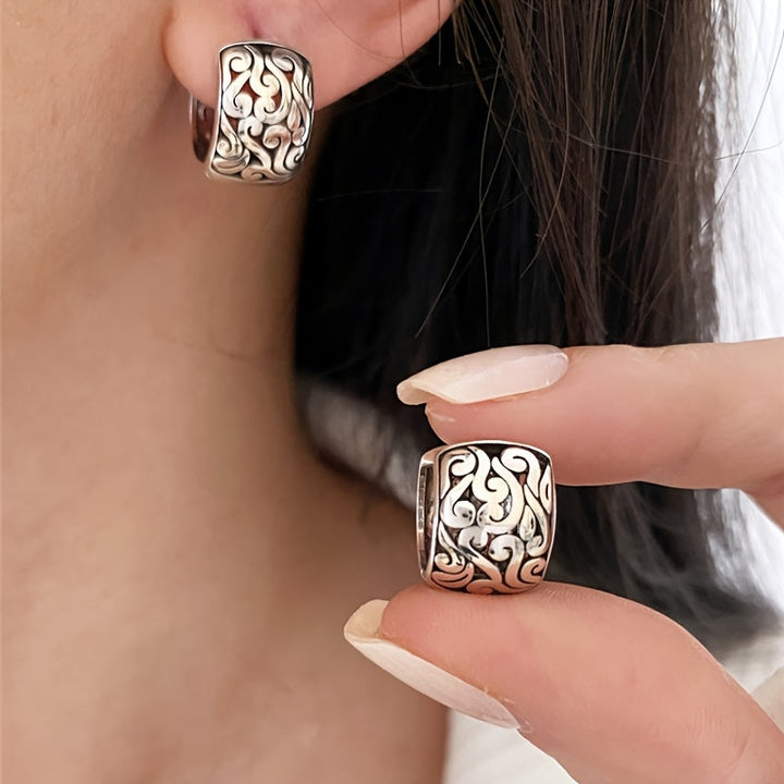 Vintage-style sterling silver engraved hoop earrings for women. Hypoallergenic and unique oxidized finish.