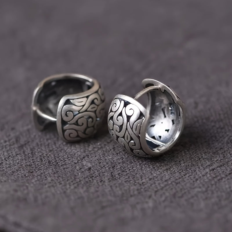 Women's engraved sterling silver hoops, hypoallergenic vintage jewelry with a secure clasp, unique style.