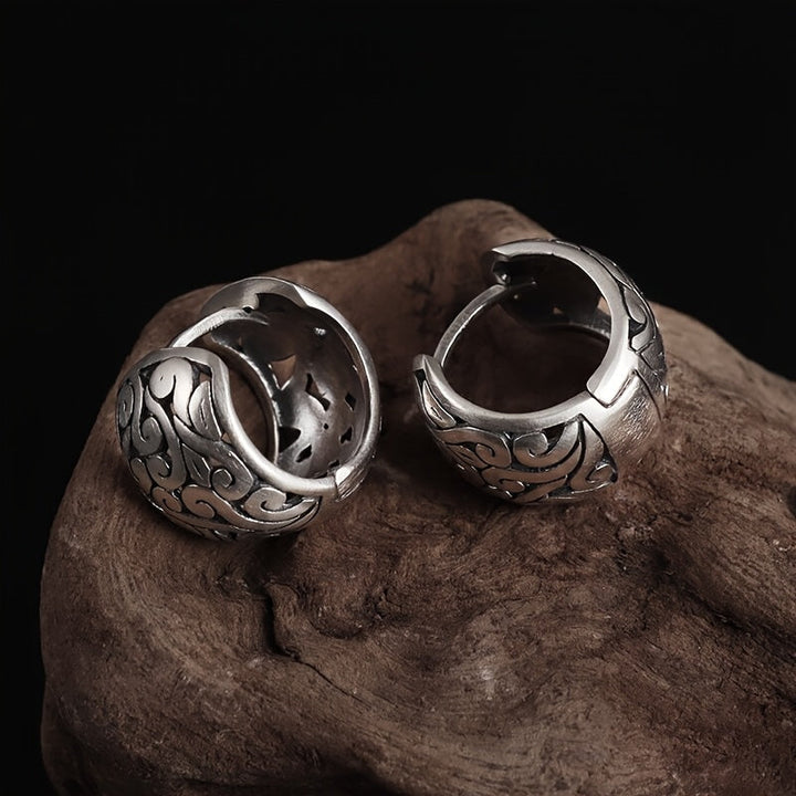 Sterling silver engraved hoop earrings, showcasing a beautiful antique finish, secure clasp, and unique design.