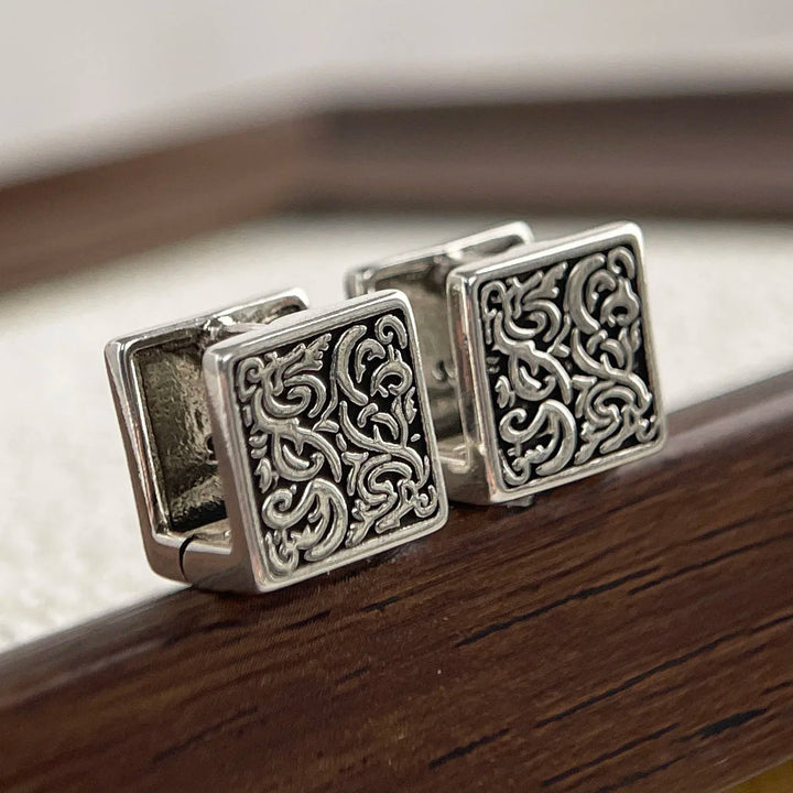 Relic sterling silver women's hoops, engraved with an antique oxidized finish for a classic vintage jewelry look.
