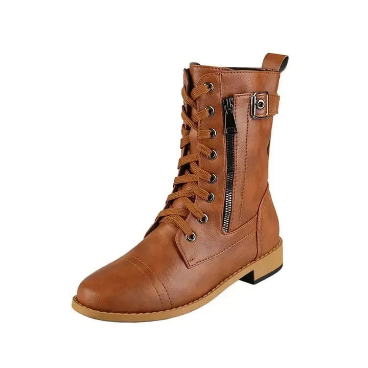 Front shot of women's edgy mid-calf buckle boots, showcasing laces, buckles, and design.