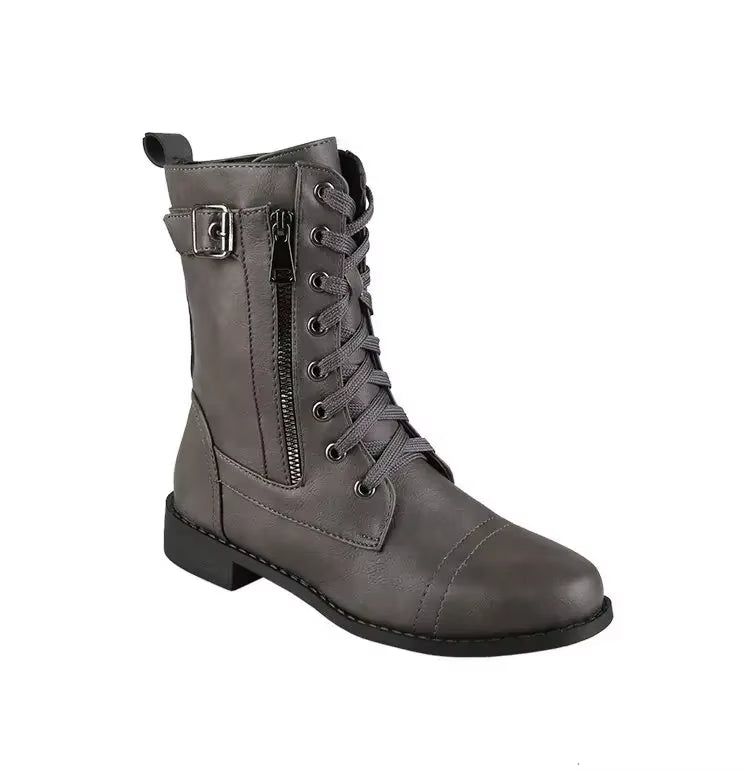 Close-up of women's mid-calf buckle boots, featuring sturdy construction and fashion details.