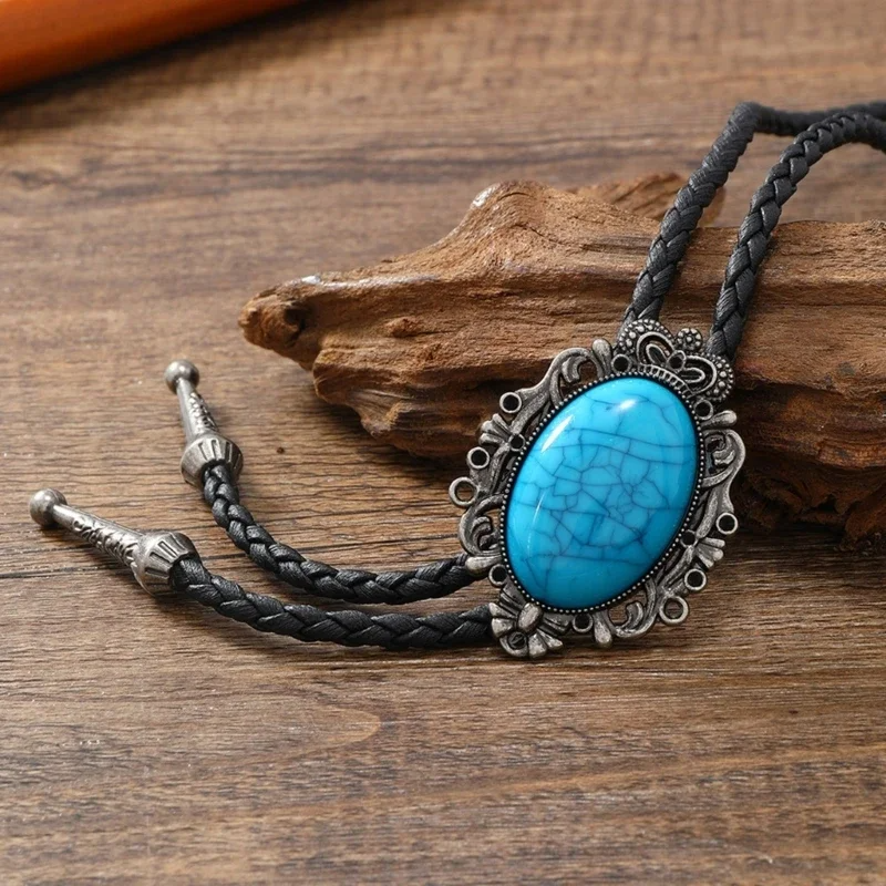 Detailed tribal pattern bolo tie for women, with turquoise & onyx accents on a chic leather necklace.