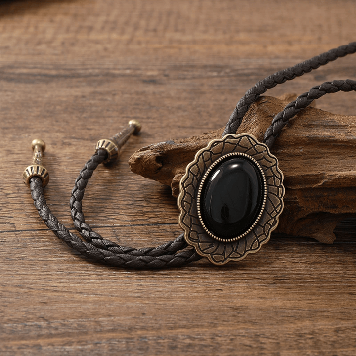 Statement tribal bolo tie for women, handcrafted with genuine leather, turquoise, and onyx. A unique accessory.