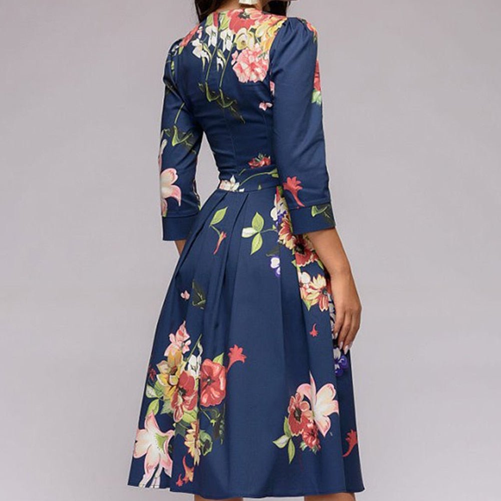 Chic vintage-inspired midi dress with 3/4 sleeves. A-line silhouette offers modern elegance.