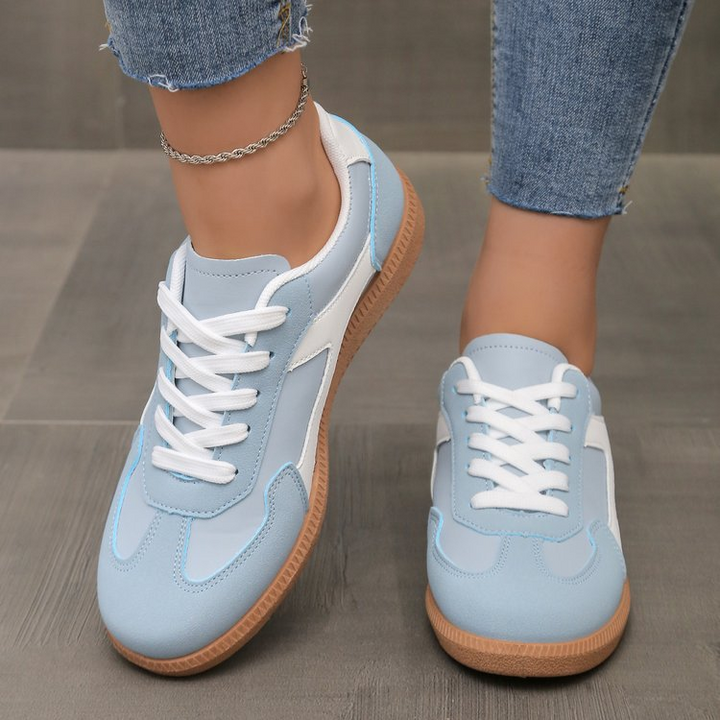 Fashionable women's retro sneakers, stylish footwear for casual looks & street style outfits.