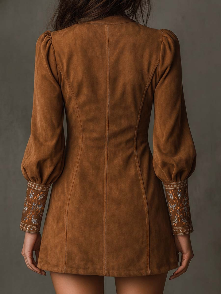 Close-up of elegant floral embroidery detail on a stylish retro chic women's mini dress.