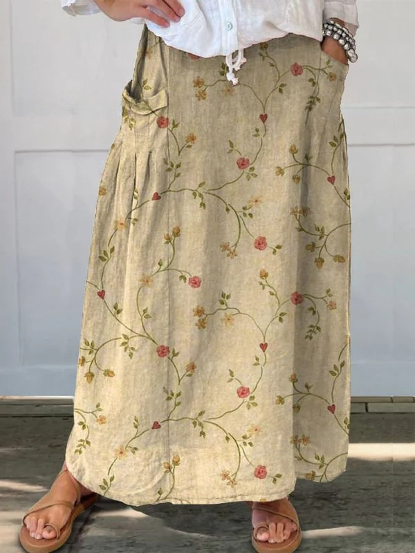 Women's retro floral art A-line skirt with pockets, perfect for vintage style summer casual wear and elastic waist.