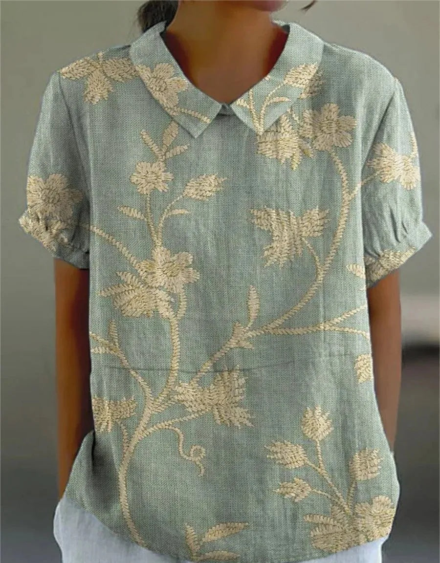 Women's retro floral embroidered top, short sleeve & collared. Perfect for summer casual.