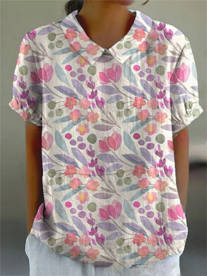 Summer fashion women's floral blouse, retro style with charming embroidery. Short sleeve.