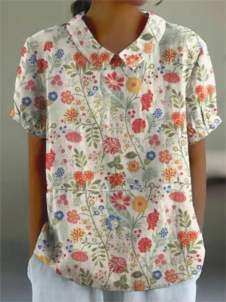 Women's collared floral top, retro design with elegant embroidery. Short sleeve for summer.