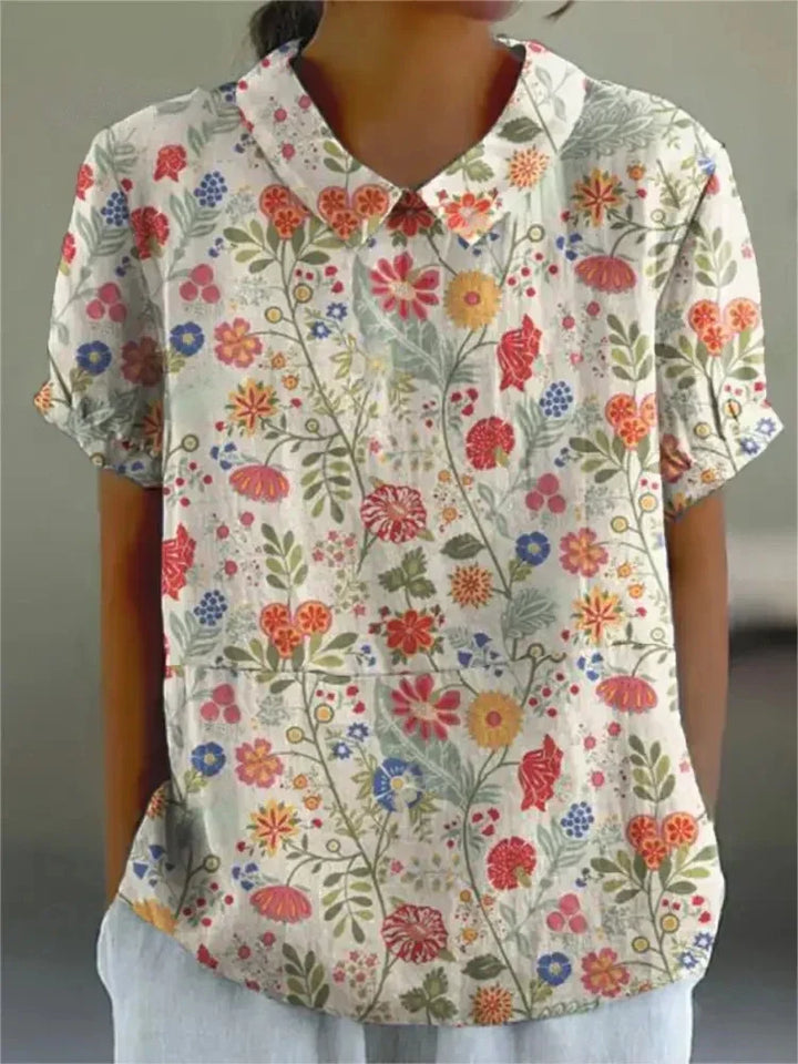 Women's collared floral top, retro design with elegant embroidery. Short sleeve for summer.
