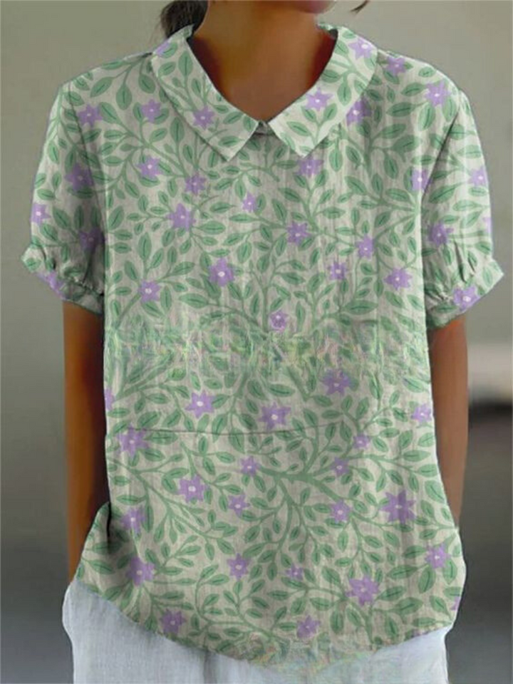 Embroidered retro floral women's blouse, collared and relaxed fit. Ideal for summer fashion.