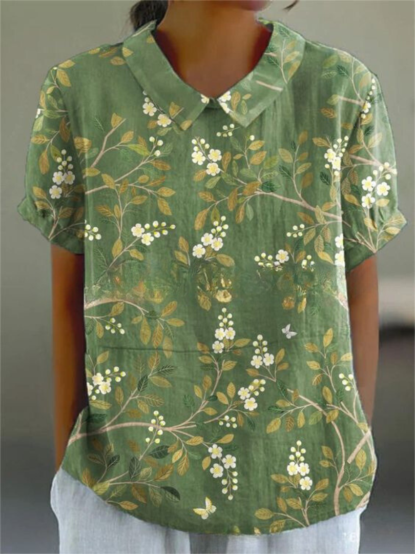 Retro style women's floral blouse, embroidered design, comfortable relaxed fit. Summer vibes.