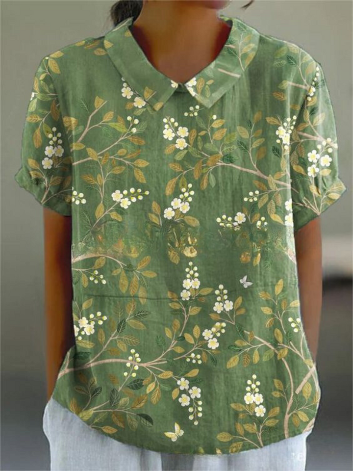 Retro style women's floral blouse, embroidered design, comfortable relaxed fit. Summer vibes.
