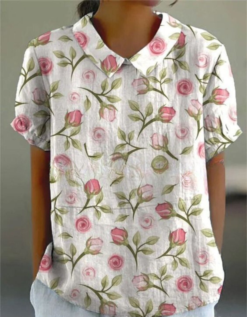 Collared women's floral embroidered top in a retro design. Perfect for summer vacations.