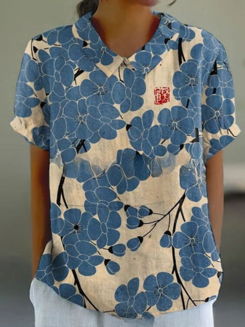 Relaxed fit women's retro floral top with beautiful embroidery. A vintage-inspired blouse.