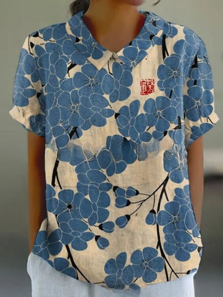 Relaxed fit women's retro floral top with beautiful embroidery. A vintage-inspired blouse.