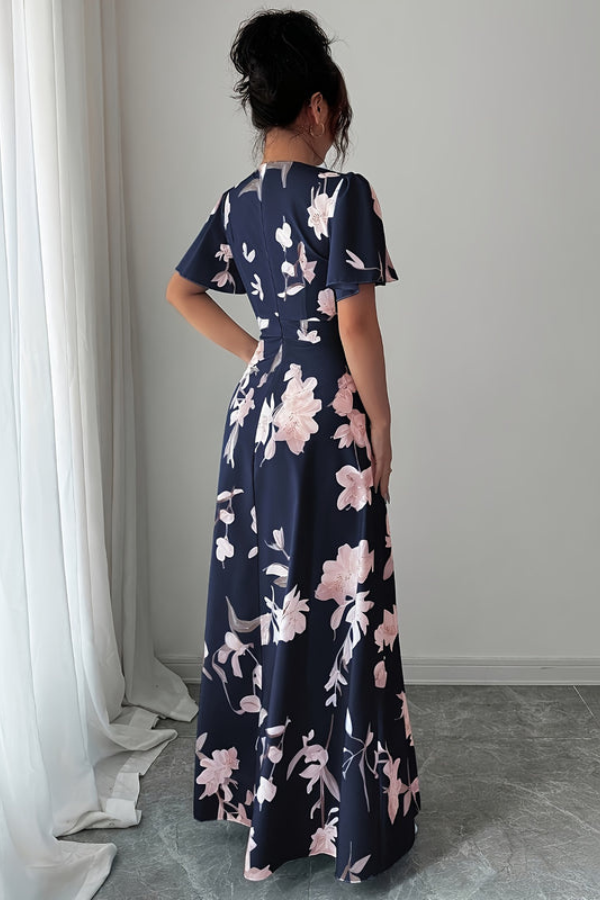 Flowy women's midi dress, retro floral pattern, pleated for elegant spring outfits.