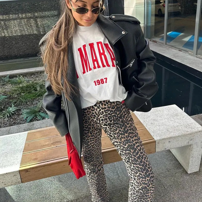 Trendy women's retro leopard print high-waisted jeans, a chic statement piece for fashion lovers.