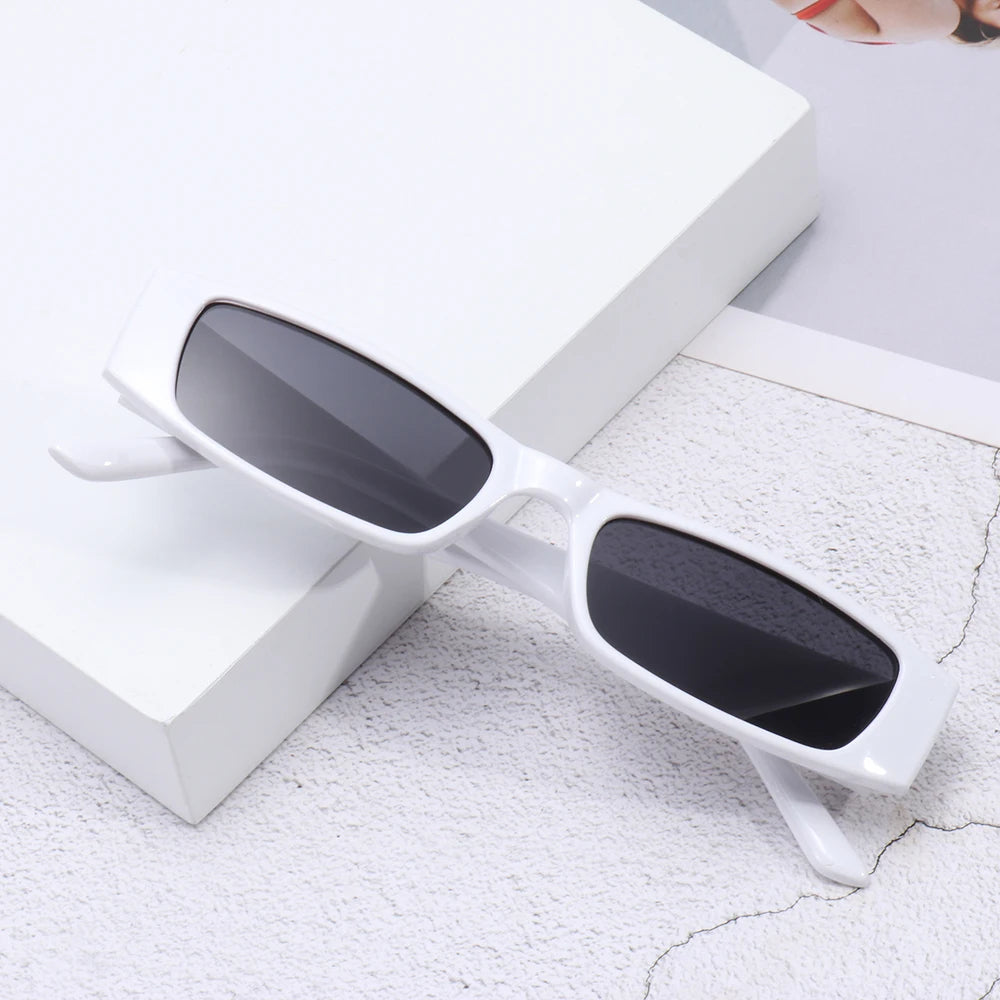 Women's UV protection sunglasses, retro slim rectangular design, chic 90s fashion.