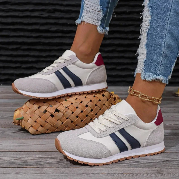 Women's retro stripe casual sneakers with blue & gray colorblock design. Lace-up everyday footwear for stylish street fashion.