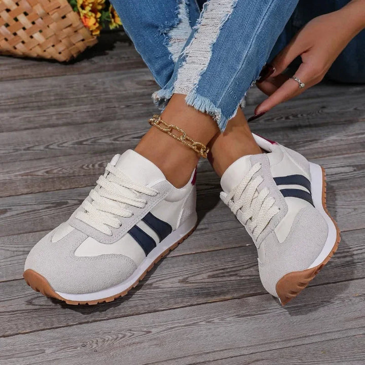 Comfortable women's retro sneakers, blue & gray colorblock. Lace-up casual footwear for everyday wear & vintage aesthetic.