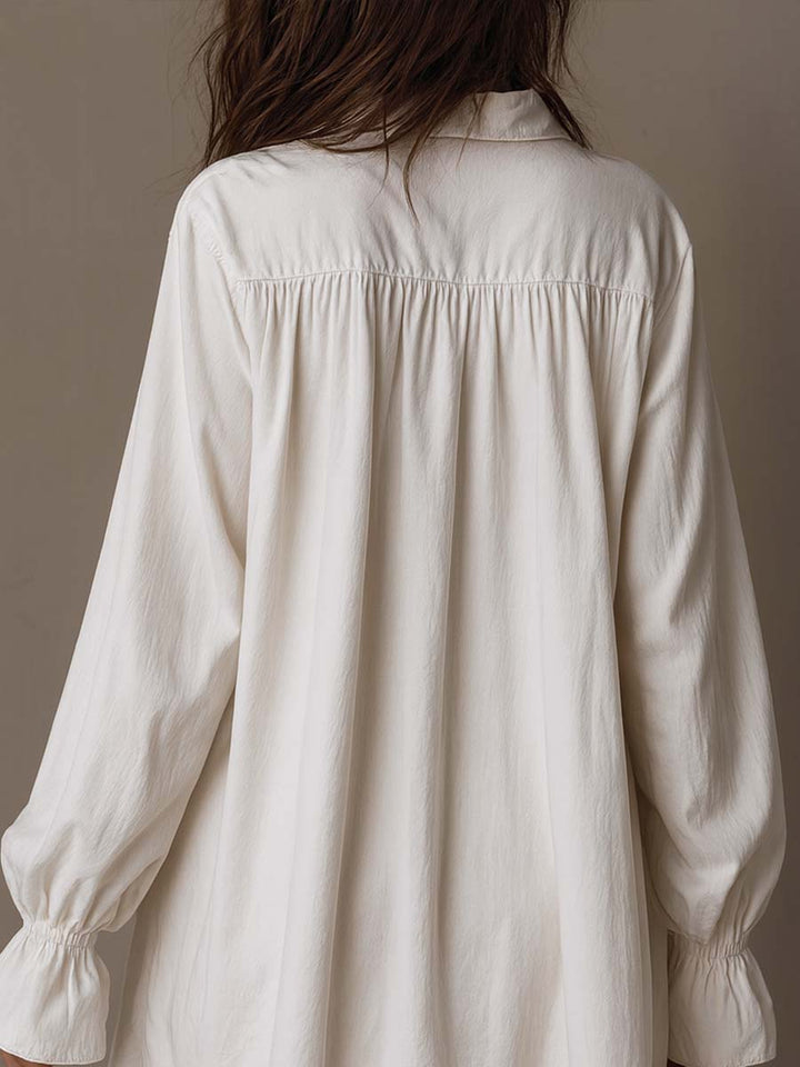 Vintage-inspired white lace long-sleeve dress for women, featuring a unique irregular hem. Elegant party wear.