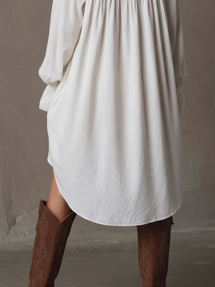 Elegant women's white lace long-sleeve dress with a stylish irregular hem, ideal for special occasion wear.