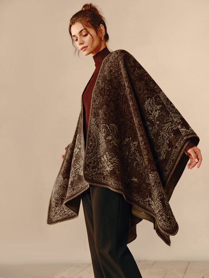 Women's reversible bohemian poncho wrap with fringed hem, perfect for versatile layering & chic style.