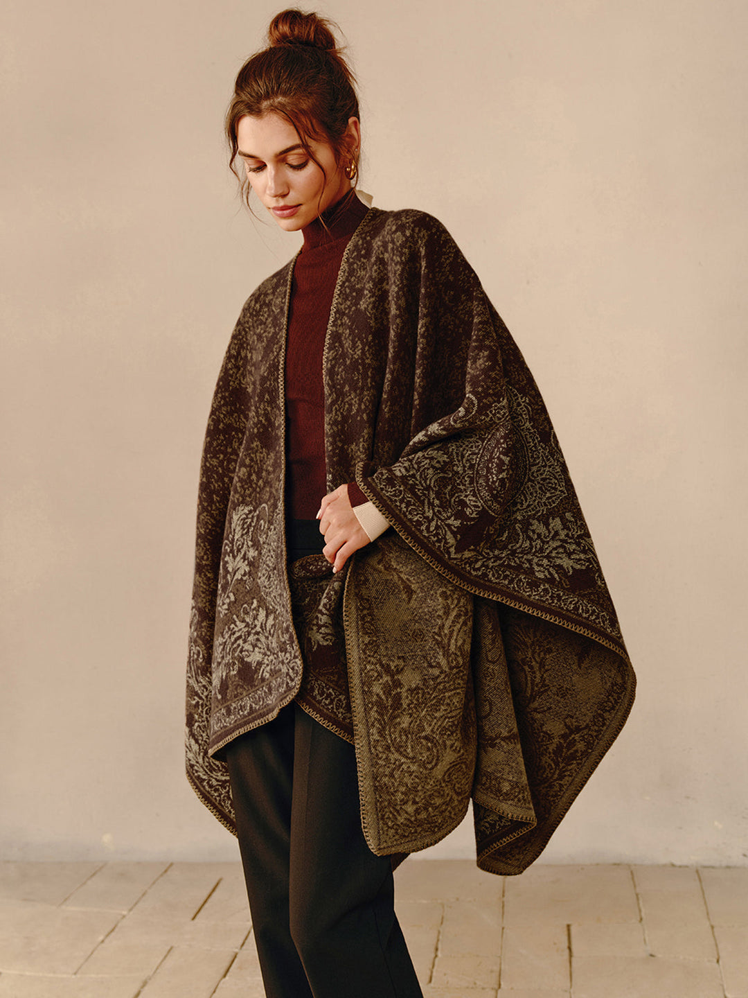 Elegant women's bohemian poncho shawl in a soft fabric, offering comfortable & stylish outerwear.