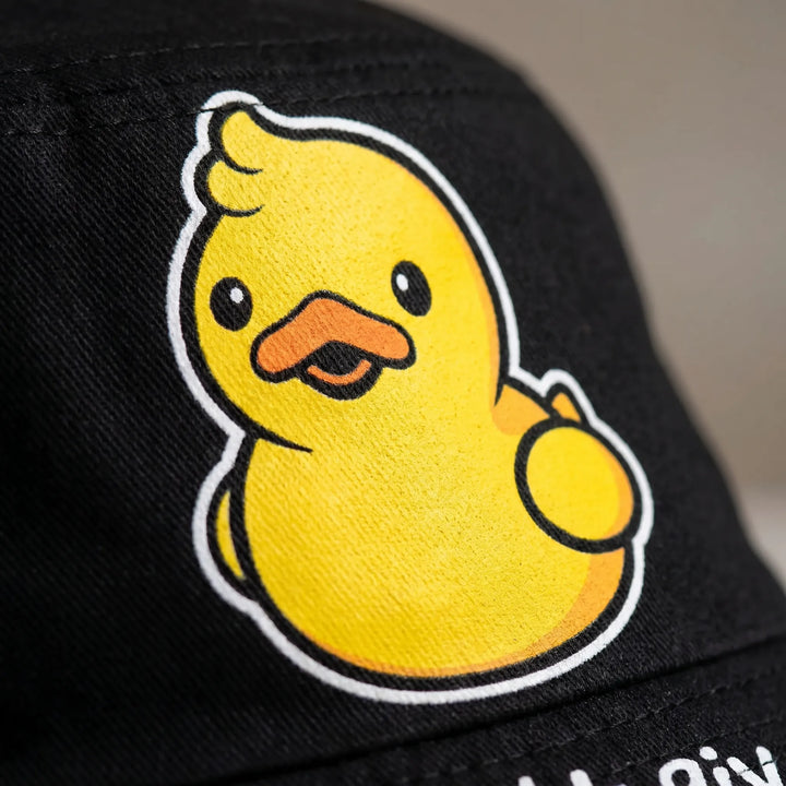 Stylish reversible women's bucket hat showcasing a fun duck print. A versatile accessory for any casual outfit.