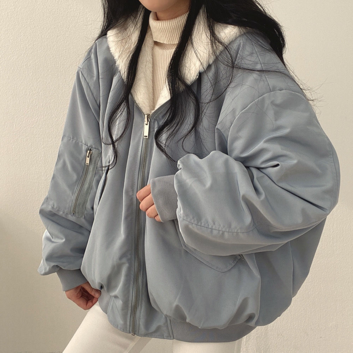 Women's reversible hooded jacket, cozy & versatile for fall/winter fashion.