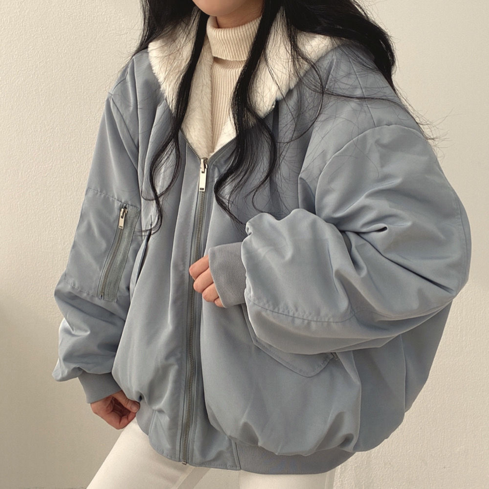 Winter-ready women's hooded jacket, reversible design for warmth & style.