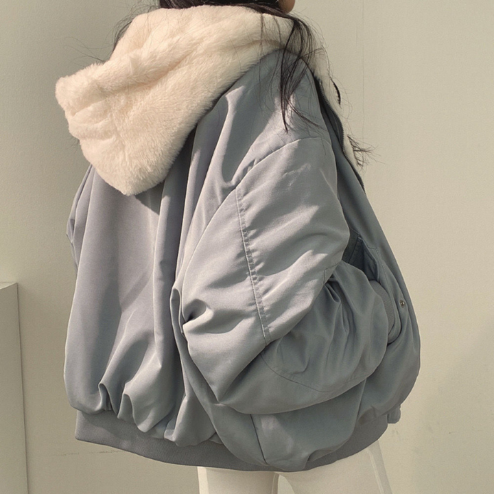 Versatile women's reversible hooded jacket, ideal for changing styles & weather.