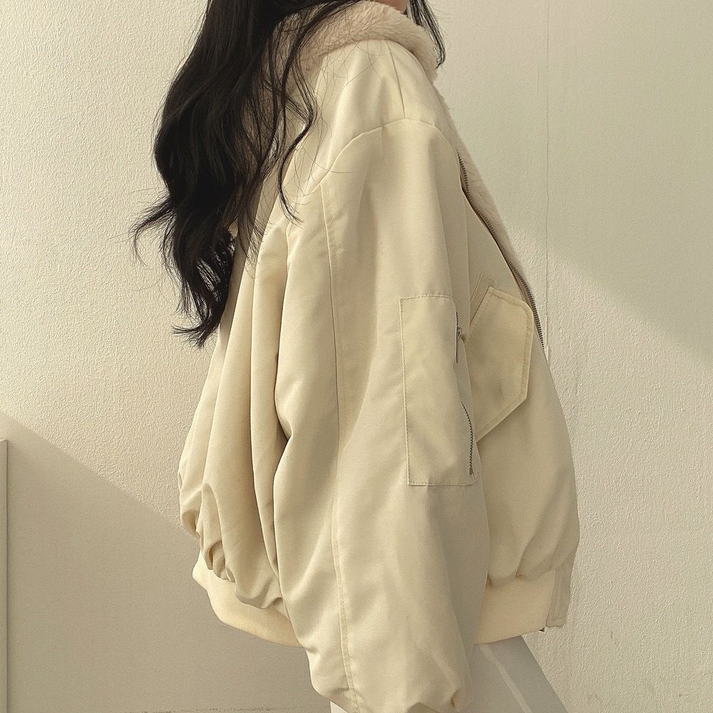 Beige side of women's reversible hooded jacket, essential fall fashion & comfort.