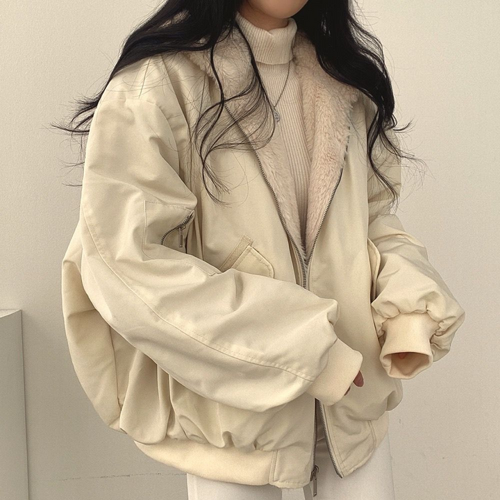 Warm & cozy women's hooded jacket, reversible design for versatile layering.