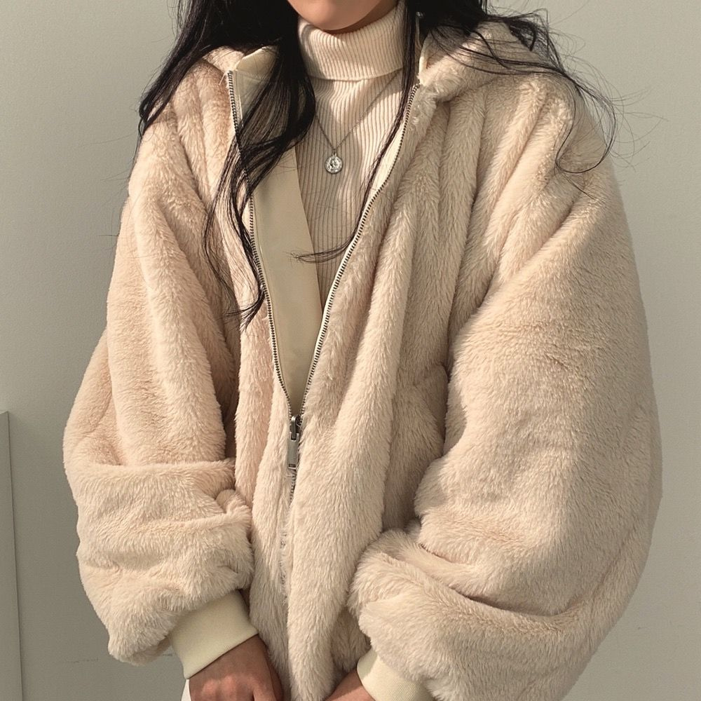 Stylish women's reversible hooded jacket, a versatile outerwear piece for any look.
