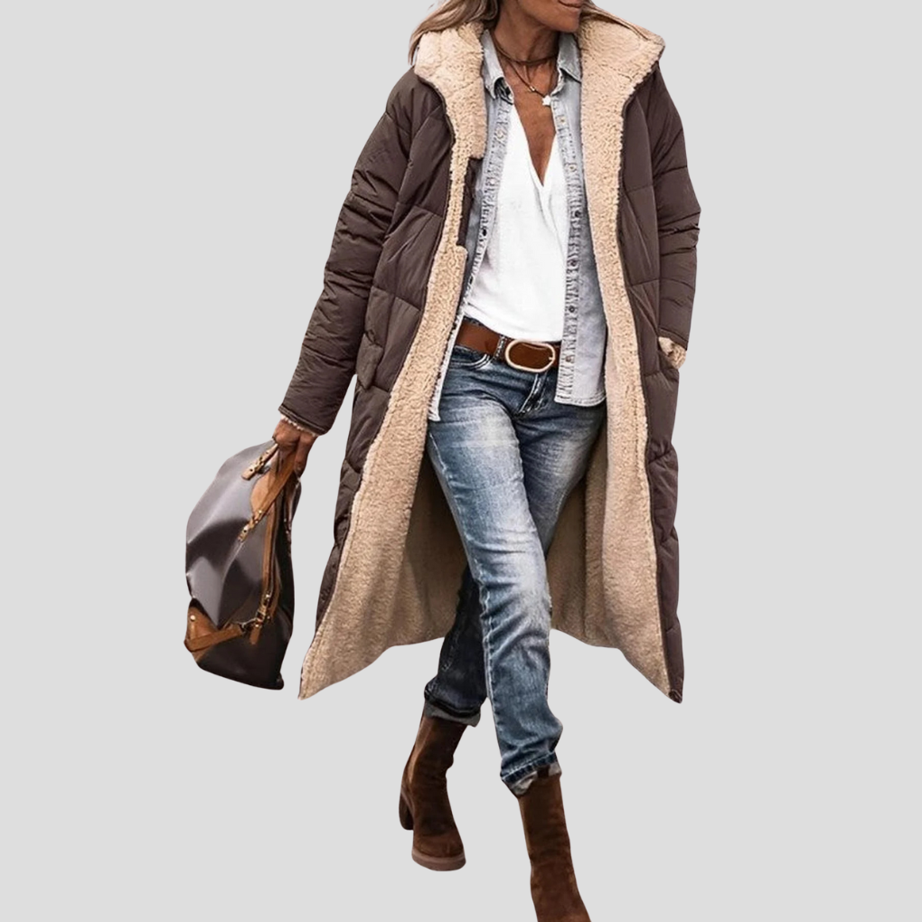 Back view of women's long reversible hooded winter coat, providing full coverage for ultimate warmth.