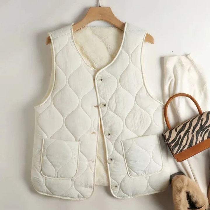 Women's reversible quilted vest in khaki & beige, a versatile layering piece for casual style.