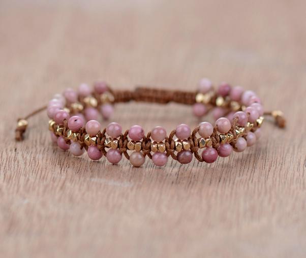 Women's Rhodonite Heart Energy bracelet with polished pink rhodonite beads, adjustable cord, for emotional balance