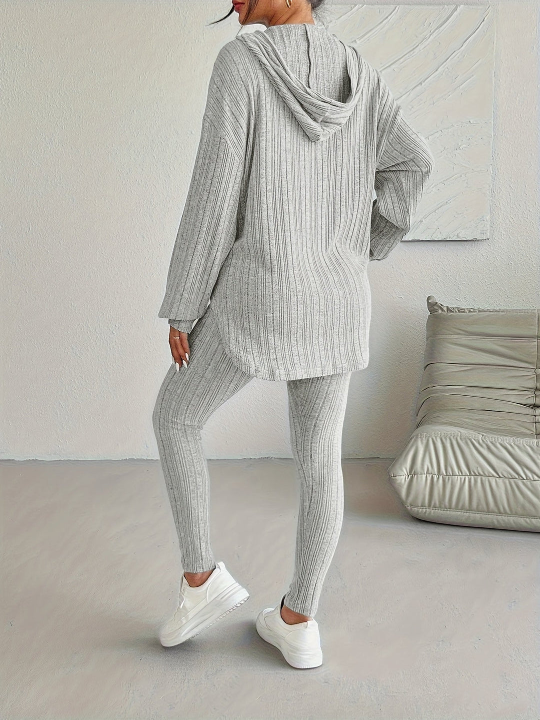 Stylish white ribbed knit lounge set. Women's cozy two-piece casual outfit, perfect for everyday comfort.