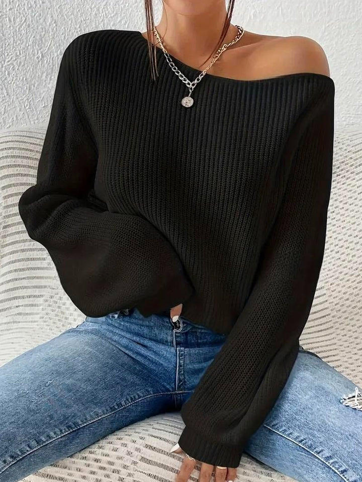 Model wearing a women's ribbed off-shoulder top, showcasing its chic style and effortless fit for fall.
