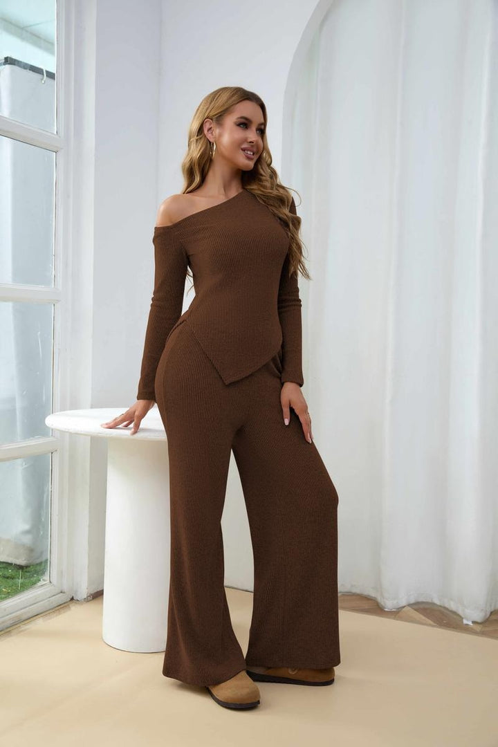 Chic women's one-shoulder ribbed two-piece set with comfortable wide-leg knit trousers, ideal for lounging.