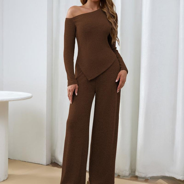 Elegant women's one-shoulder ribbed top & wide-leg trousers knit two-piece set for lounge or casual wear.
