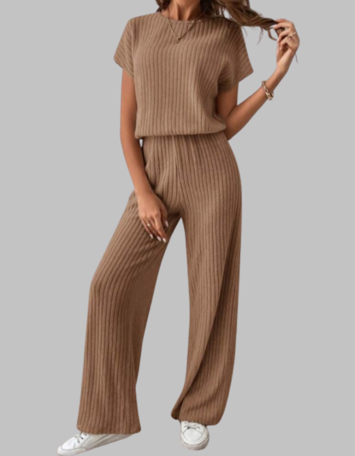 Model wearing a comfortable women's ribbed two-piece set (top & wide-leg pants) in a neutral color.