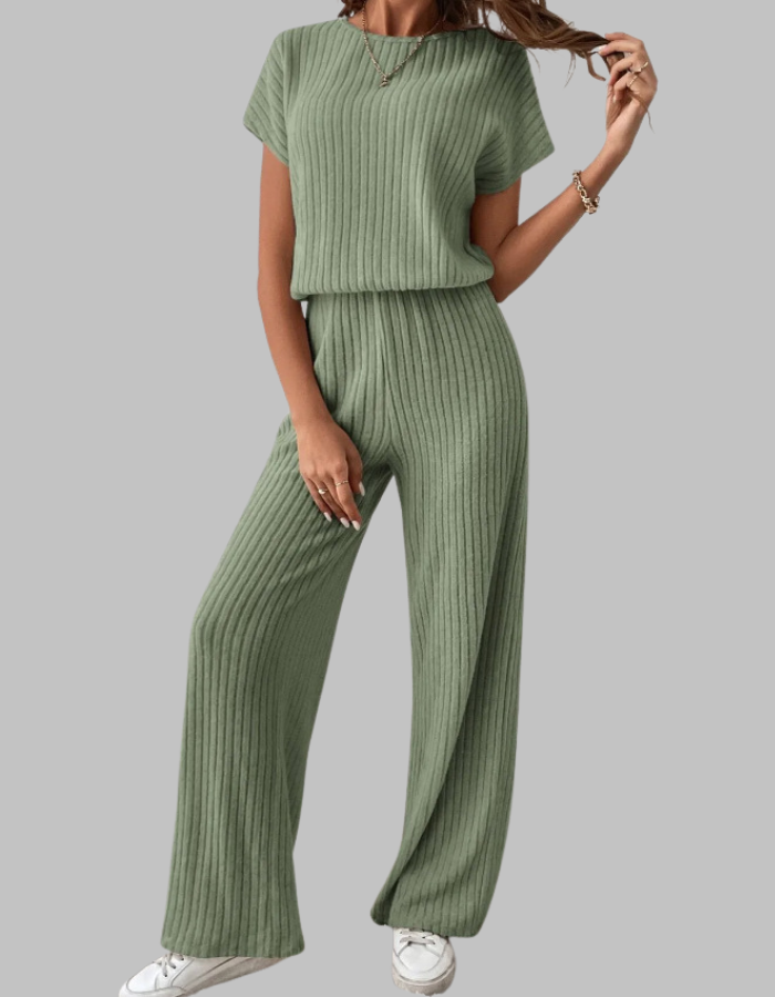 Close-up of ribbed knit texture on a women's two-piece set, short sleeve top & wide-leg pants. Comfortable fabric.