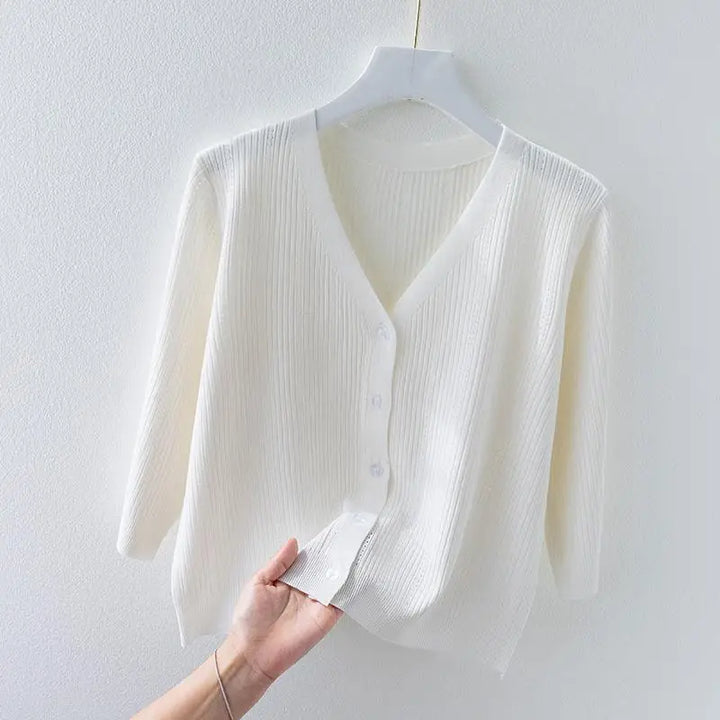 Women's ribbed v-neck knit cardigan with button front for comfortable layering.