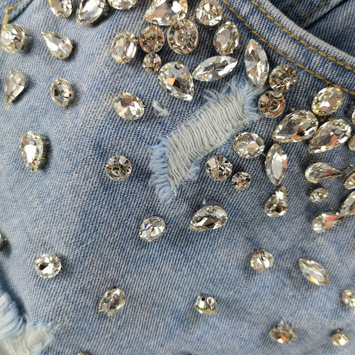 Trendy women's high-waist wide-leg shorts with ripped details. Perfect casual distressed denim for spring fashion.